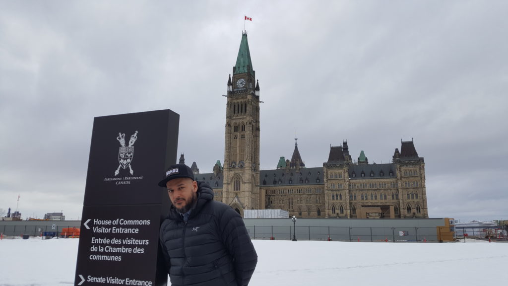 Adrian Sutherland in front of the Parliament Building in Ottawa 